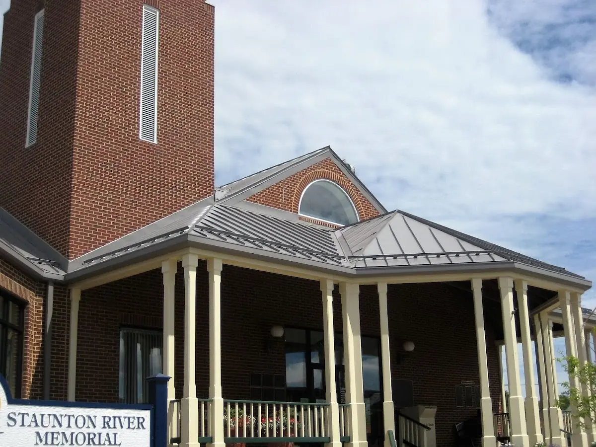 Skilled roofing craftsmen working on a residential roof in Staunton